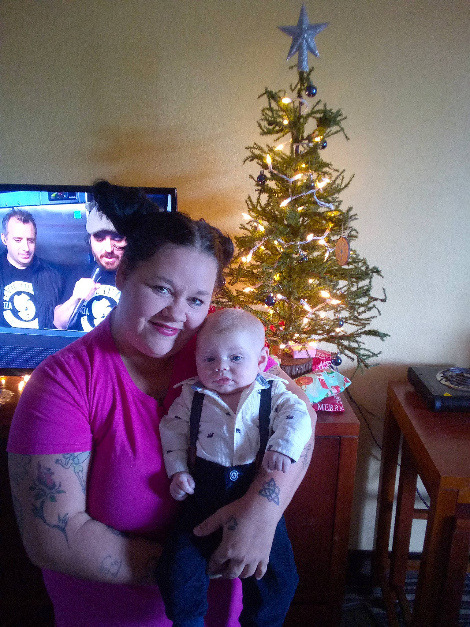 Zander joined the competition — help win amazing prizes! baby, christmas, christmas_decoration, christmas_eve, christmas_ornament, christmas_tree, conifer, event, evergreen, fun, happy, holiday, holiday_ornament, joy, lap, ornament, person, room, smile, standing