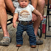 Stetson joined the competition — help win amazing prizes! toddler, child, baby, texas, tshirt, jeans, belt, boots, hands, adult, wooden_deck, floor, person, outdoor, legs, clothing, footwear, expression, standing, support
