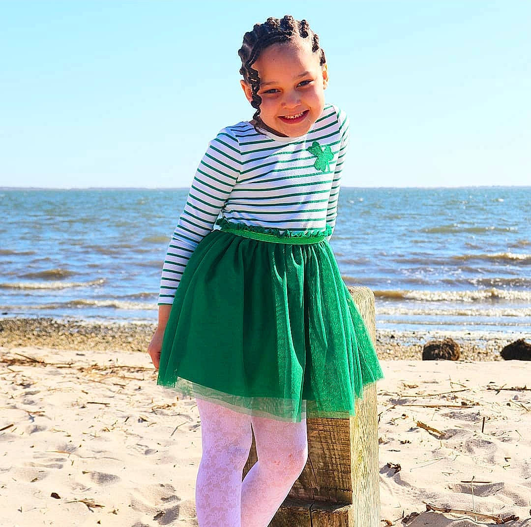 Jasmyn is registered to the contest to win money with this photo: azure, beach, day_dress, dress, face, fashion_design, fun, happy, joy, people_in_nature, person, sand, shoulder, sky, sleeve, smile, street_fashion, summer, toddler, travel