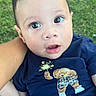 baby, infant, child, outdoor, grass, person, navy_shirt, bear_design, cute, wide_eyes, curious, hand, arm, digital_sticker, hearts, cartoon, holding, portrait, casual_clothing, young