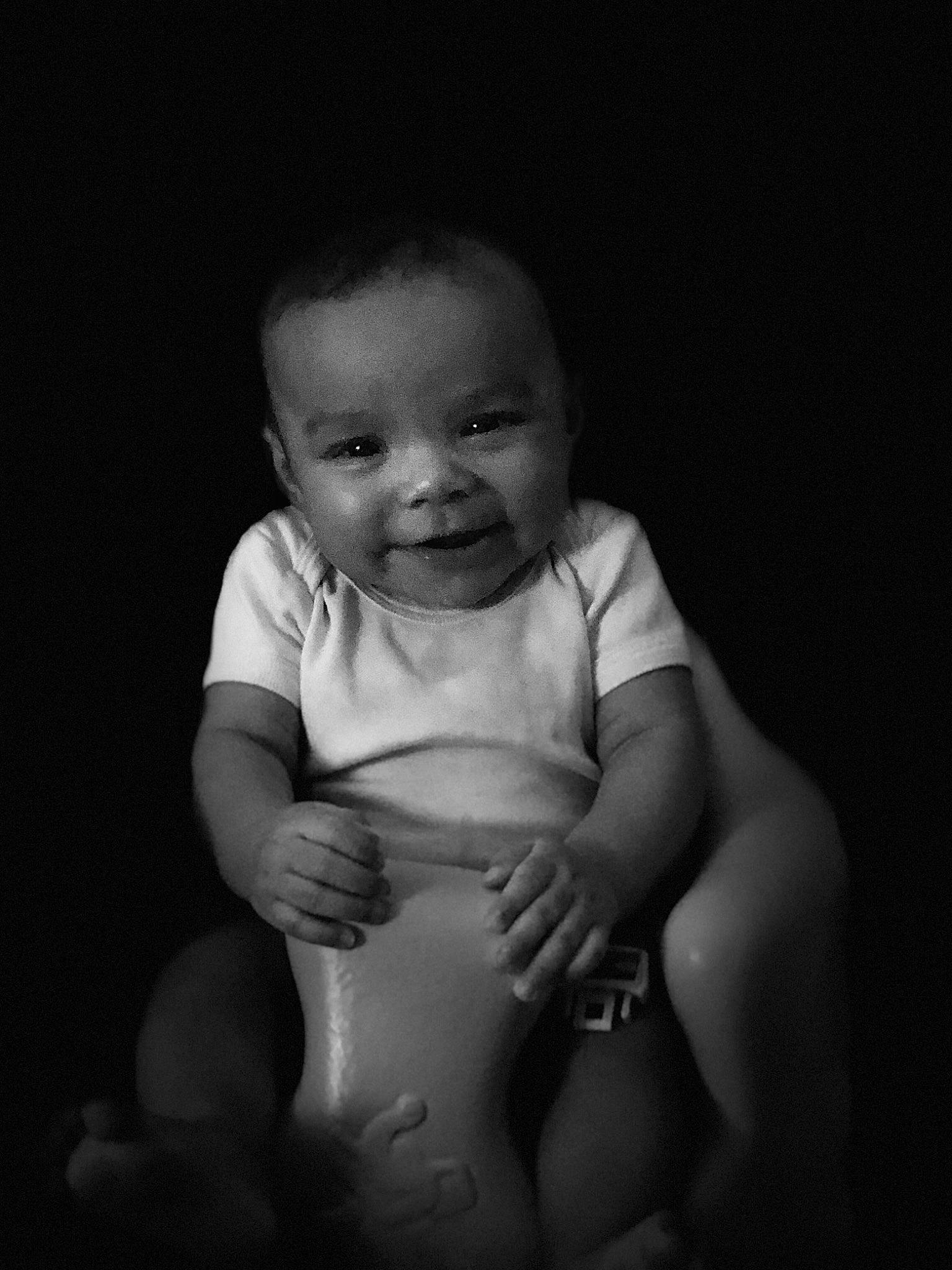 Kaliya is registered to the contest to win money with this photo: baby, black, black_and_white, cheek, child, eye, face, facial_expression, head, joy, monochrome, monochrome_photography, people, person, photograph, photography, skin, smile, snapshot, standing