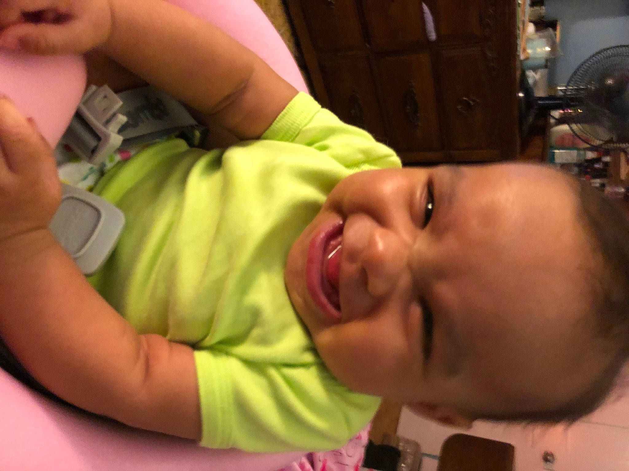 Kaliya is registered to the contest to win money with this photo: arm, baby, cheek, child, ear, eye, face, facial_expression, finger, hand, head, lip, mouth, neck, nose, person, skin, smile, thumb, toddler