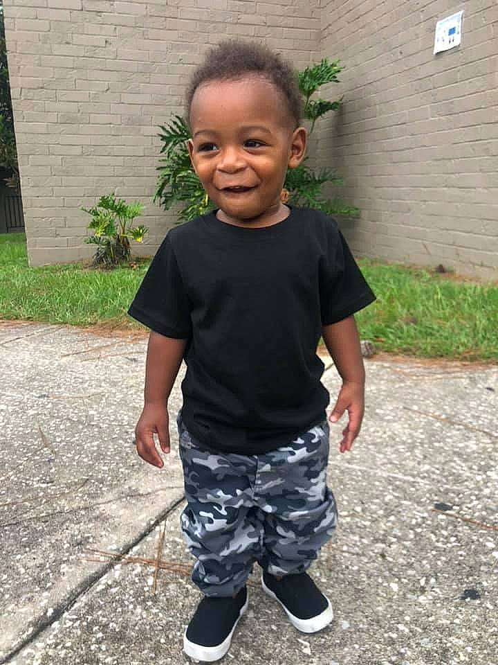 Casen joined the competition — help win amazing prizes! active_pants, active_shorts, baby, baby_toddler_clothing, bermuda_shorts, brick, child, concrete, person, shoe, sneakers, standing, sweatpant, toddler, walking_shoe, yard