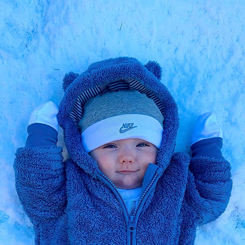 Reno joined the competition — help win amazing prizes! baby, cap, clothing, coat, face, glove, hat, head, hood, hoodie, jacket, knitwear, nature, outdoors, person, photography, portrait, snow, sweater, sweatshirt