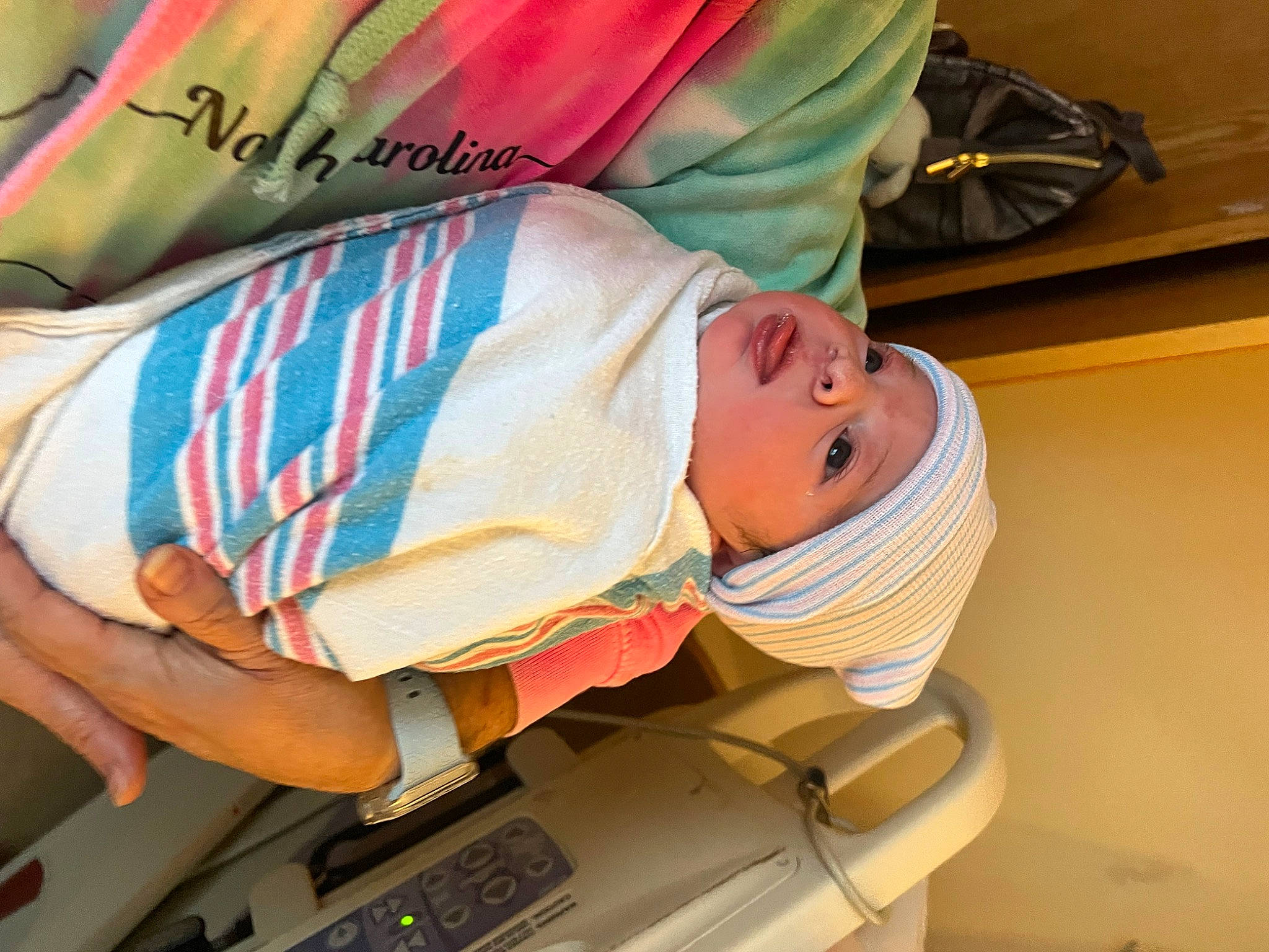 Colton is registered to the contest to win money with this photo: auto_part, baby, baby_products, car_seat, child, comfort, elbow, fashion_accessory, fun, headwear, leisure, pattern, person, service, sitting, sleeve, t_shirt, toddler, vehicle_door