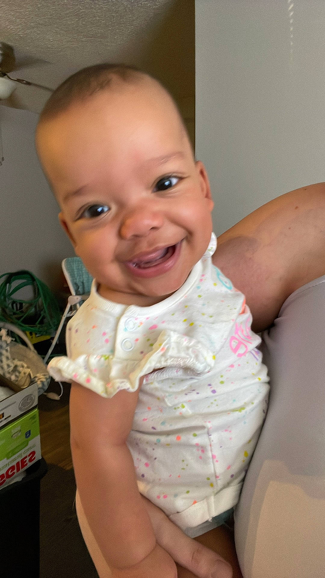 Heaven is registered to the contest to win money with this photo: baby, baby_toddler_clothing, cheek, chest, child, chin, eyelash, fun, happy, iris, joy, lip, mouth, nose, person, skin, sleeve, smile, standing, thumb