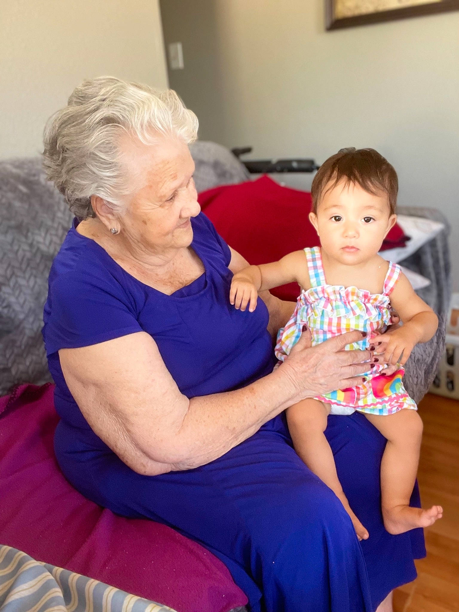 Lilibeth is registered to the contest to win money with this photo: abdomen, arm, baby_toddler_clothing, comfort, electric_blue, event, face, fun, hair, happy, human_leg, joint, lap, leg, person, picture_frame, shoulder, sitting, thigh, toddler