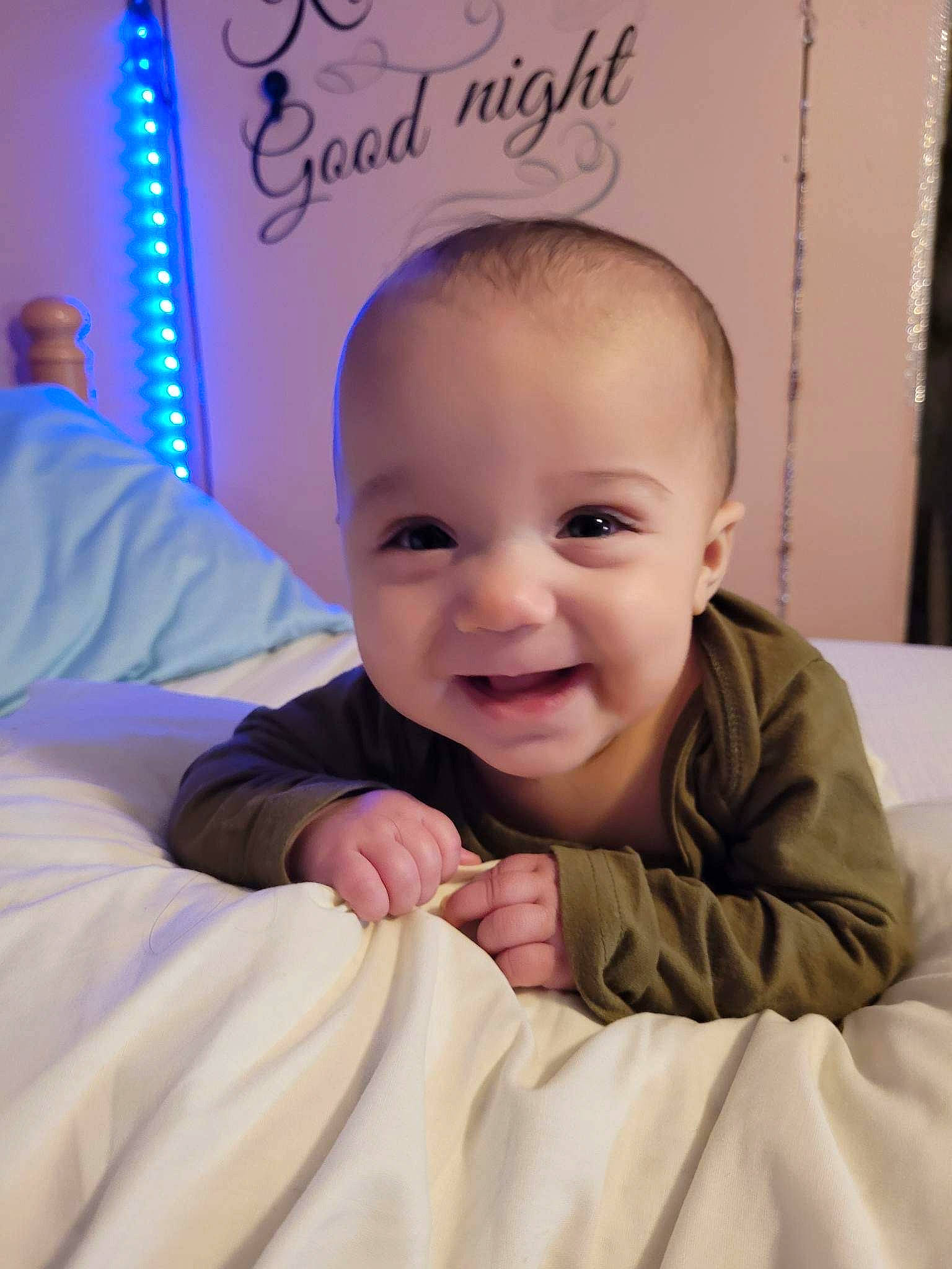 Mylee joined the competition — help win amazing prizes! baby, baby_toddler_clothing, cheek, child, comfort, eyebrow, finger, fun, gesture, hairstyle, happy, iris, joy, linens, nose, person, room, sitting, skin, sleeve