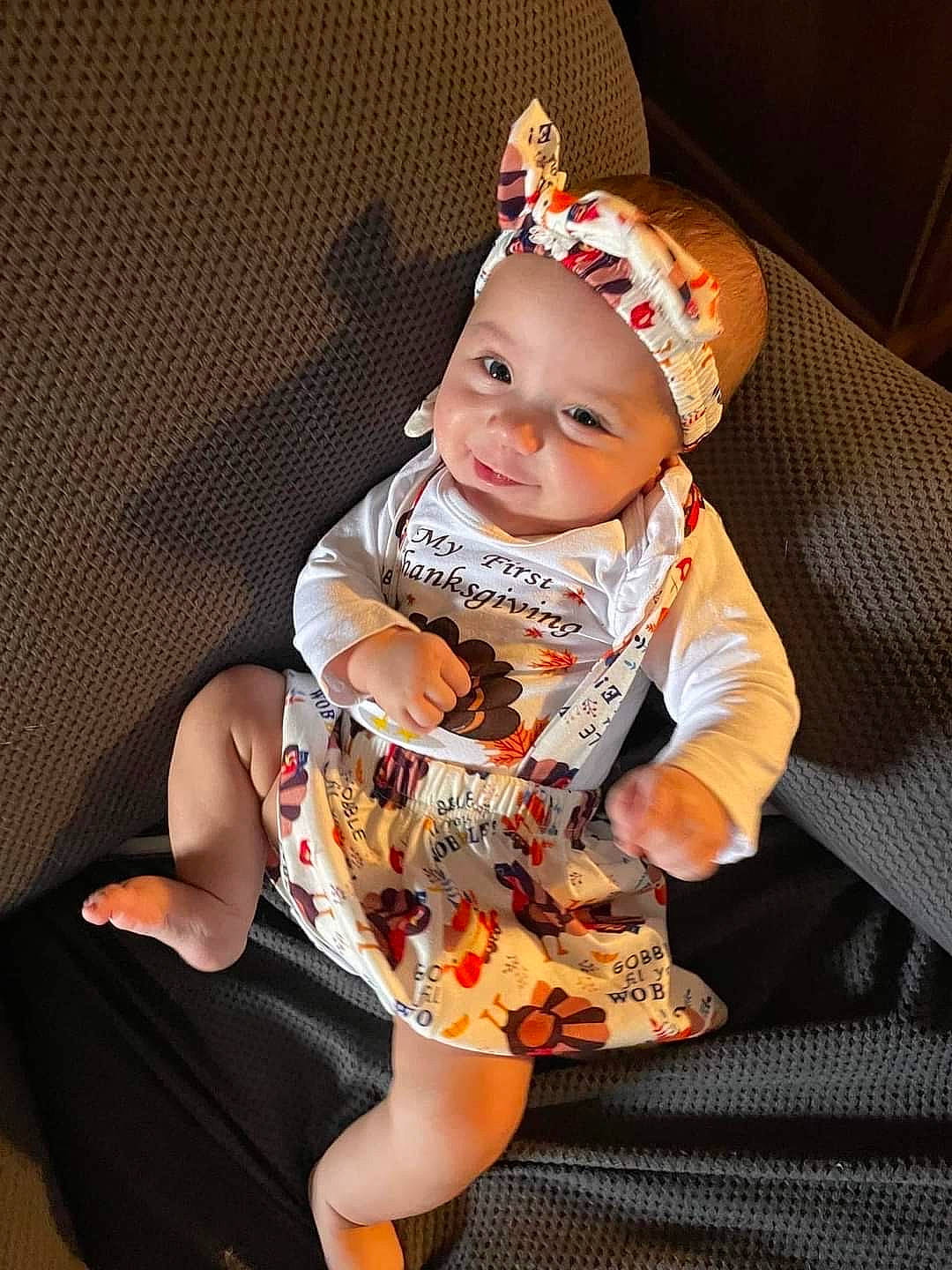 Mylee joined the competition — help win amazing prizes! baby, baby_toddler_clothing, child, comfort, costume_hat, dress, fashion_accessory, fun, happy, headwear, human_leg, knee, lap, leg, pattern, person, sandal, sitting, sleeve, smile