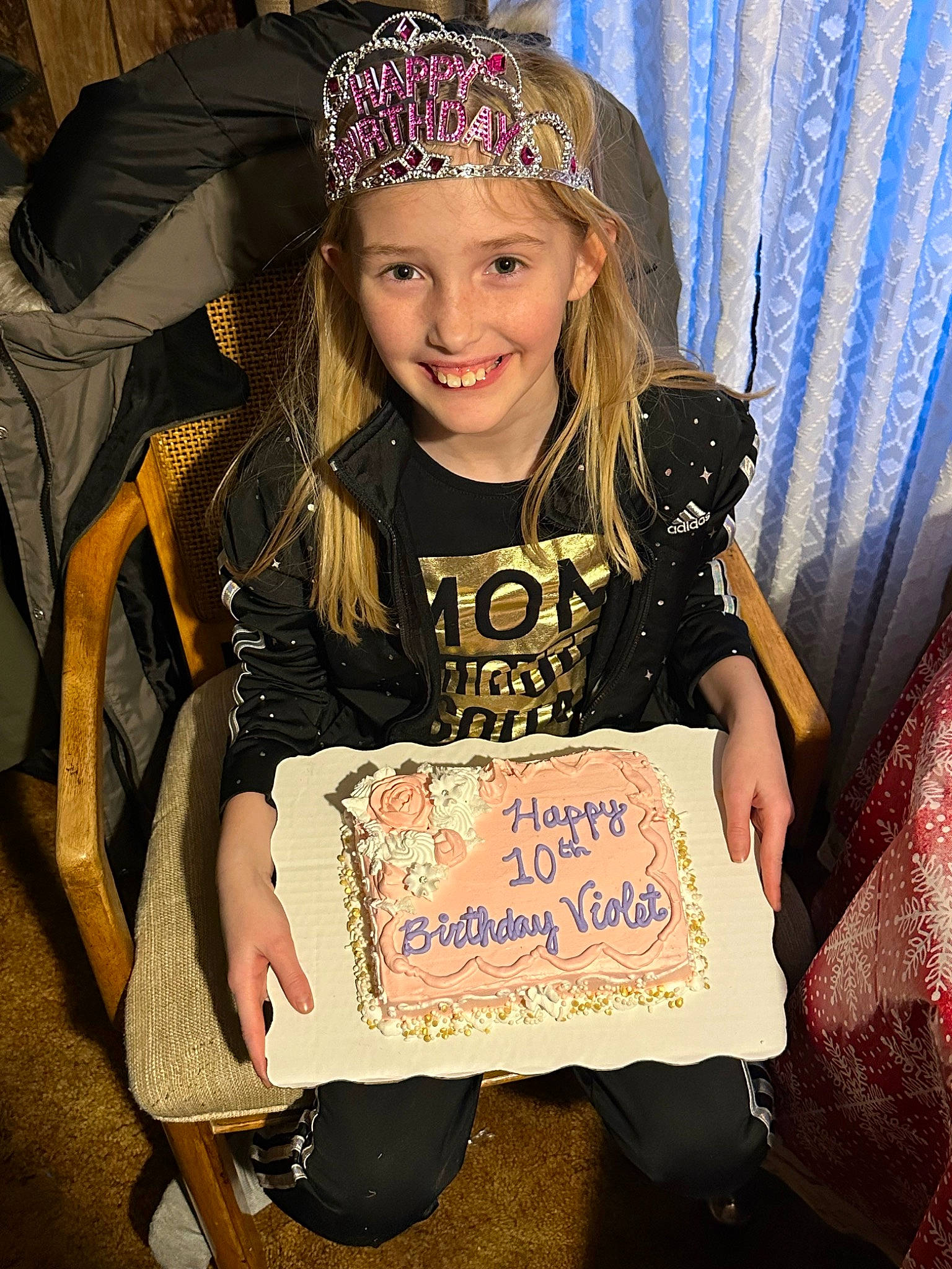 Violet is registered to the contest to win money with this photo: birthday, blond, child, cool, costume_hat, curtain, event, facial_expression, fashion_accessory, fashion_design, fun, hairstyle, handwriting, happy, headband, headpiece, headwear, jewellery, joy, person