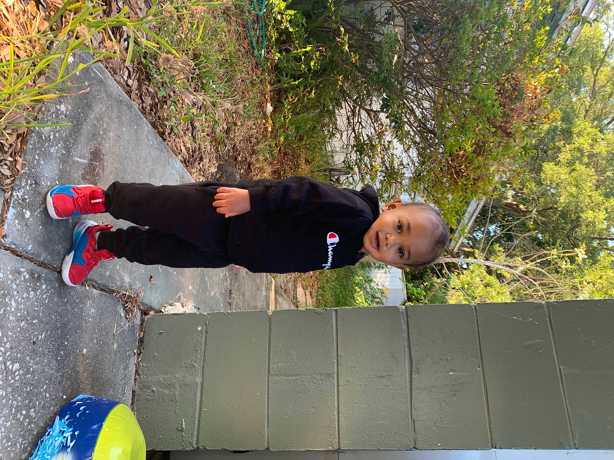 Zeus is registered to the contest to win money with this photo: active_pants, asphalt, boot, concrete, fun, grass, hat, human_leg, knee, leg, leisure, outdoor_shoe, people_in_nature, person, plant, recreation, sweatpant, thigh, tree, walking_shoe