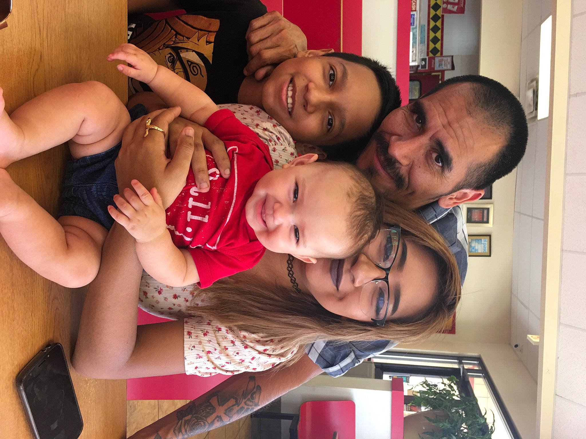 Carmen is registered to the contest to win money with this photo: arm, baby, cheek, child, event, eye, face, facial_expression, fun, hairstyle, hand, happy, joy, mouth, muscle, organ, person, red, room, smile