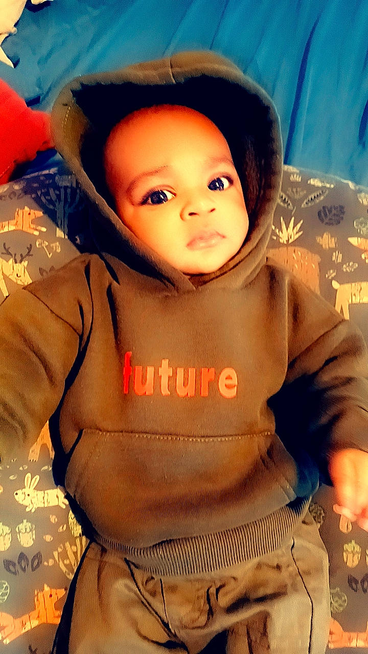 Paul Winfield is registered to the contest to win money with this photo: baby, baby_toddler_clothing, cheek, chin, cool, eye, face, flash_photography, happy, head, headgear, lip, mouth, nose, orange, organ, outerwear, person, pink, skin