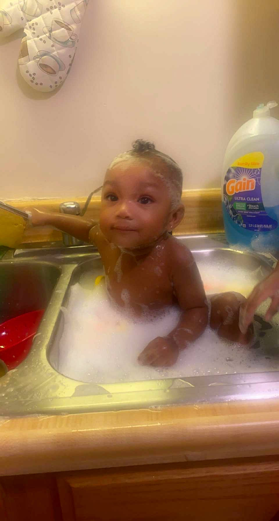 Kirah is registered to the contest to win money with this photo: baby, baby_bathing, bath_toy, bathing, bathroom, bathtub, child, clock, fluid, fun, leisure, liquid, person, personal_care, plumbing, plumbing_fixture, skin, smile, tap, toddler