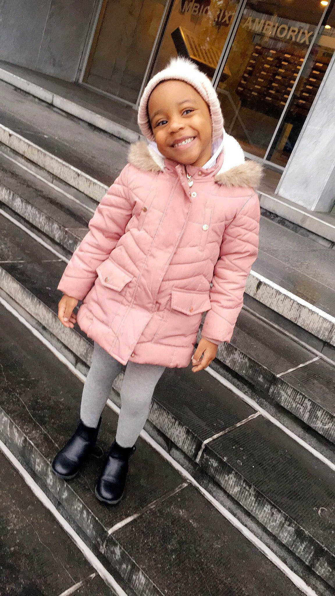 Gaby a rejoint le concours — aidez-le/la à gagner de superbes lots ! child, child_model, coat, hood, jacket, joy, outerwear, person, photography, pink, smile, snapshot, standing, toddler