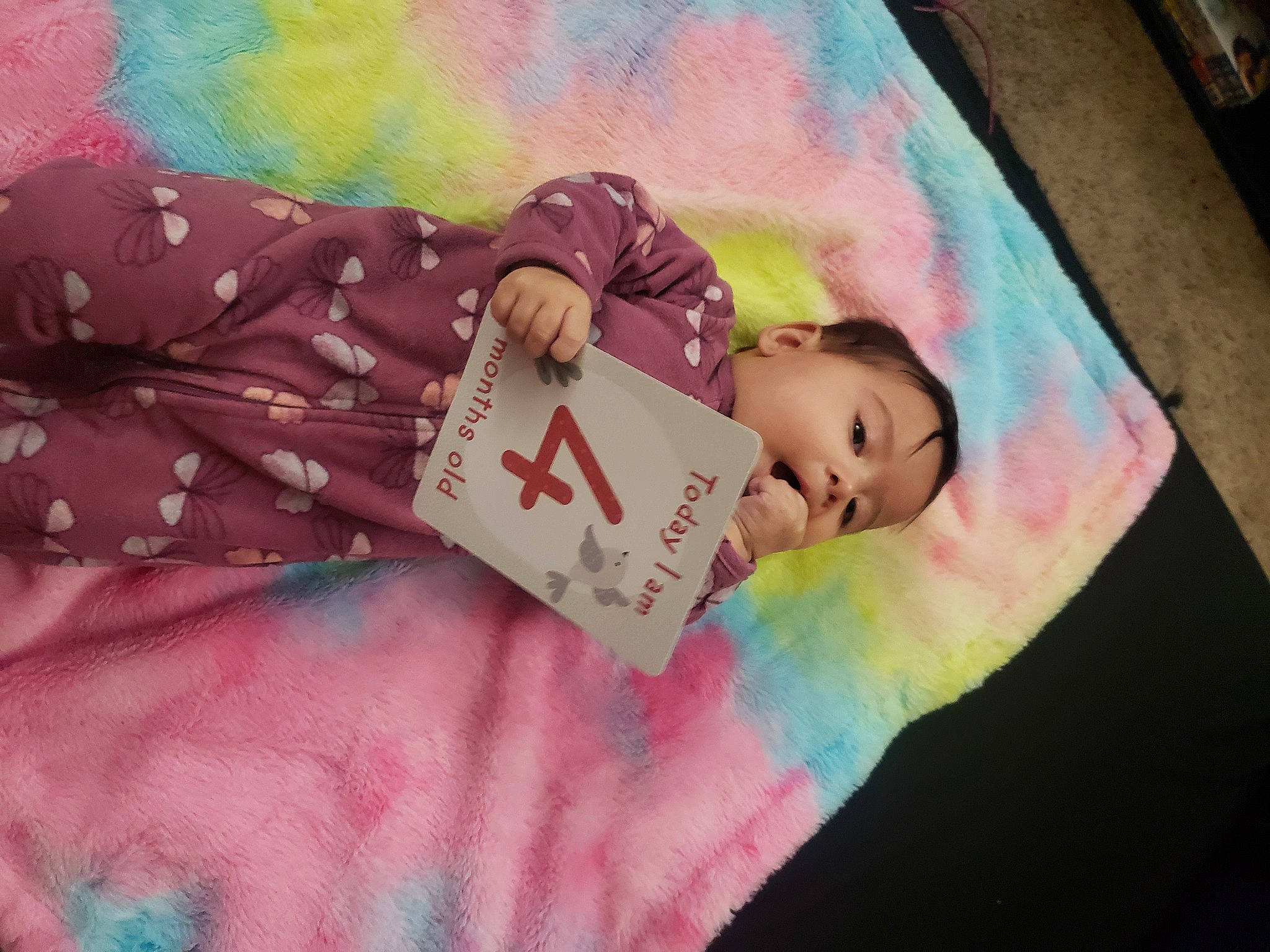 Naomie is registered to the contest to win money with this photo: art, child, design, eyelash, fashion_accessory, font, happy, linens, magenta, material_property, paint, paper, pattern, peach, person, pink, room, sweetness, textile, toddler