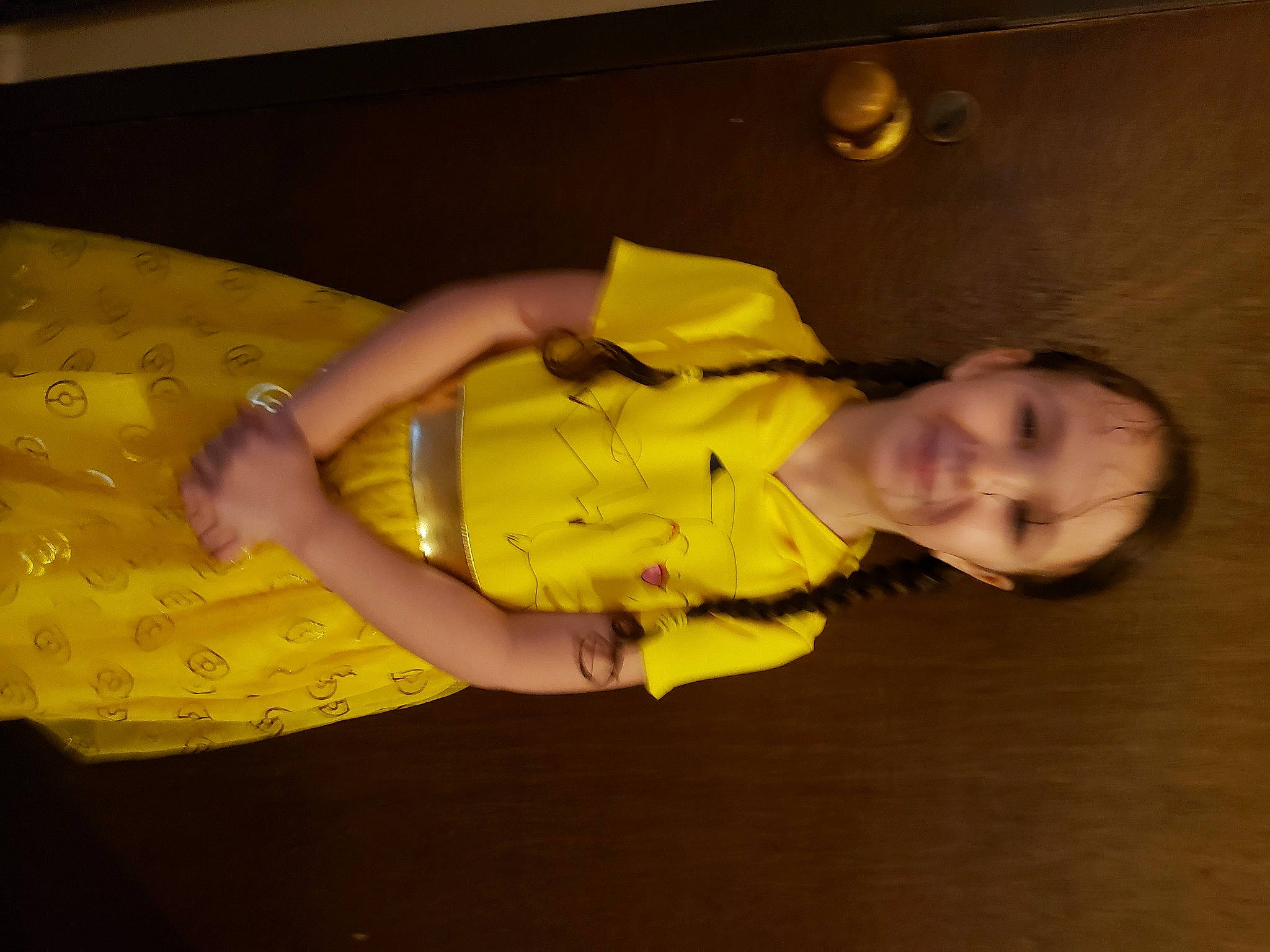 Natalie is registered to the contest to win money with this photo: baby_toddler_clothing, ceiling, child, comfort, elbow, finger, flooring, fun, gesture, happy, human_leg, joy, knee, person, room, sleeve, smile, thigh, thumb, toddler