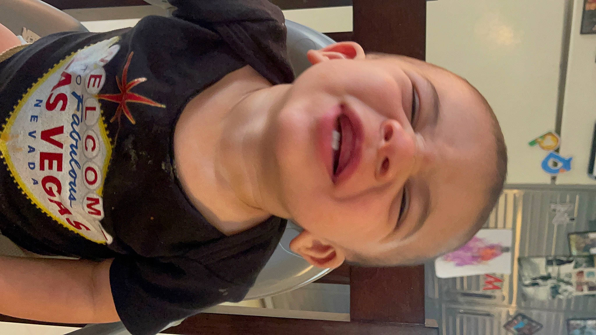 Luis is registered to the contest to win money with this photo: cheek, child, ear, eyebrow, eyelash, forehead, happy, headgear, jaw, lip, mouth, neck, nose, person, personal_protective_equipment, skin, sleeve, smile, throat, toddler