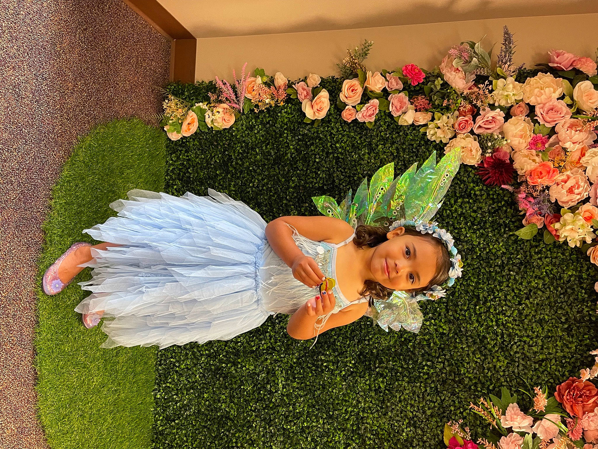 Lyla is registered to the contest to win money with this photo: angel, annual_plant, cut_flowers, event, floral_design, flower, flower_arranging, grass, happy, joy, lawn_ornament, orange, people_in_nature, person, petal, pink, plant, rose, rose_family, shrub