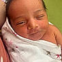 Maritza joined the competition — help win amazing prizes! newborn, baby, face, sleepy, blanket, wrapped, infant, closeup, skin, person, cute, soft, expression, head, young, peaceful, comfort, indoors, swaddle, resting