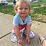 Bella joined the competition — help win amazing prizes! toddler, child, outdoor, sidewalk, grass, hello_kitty, pink_pants, blue_shirt, curly_hair, smiling, person, footwear, suburban, house, car, daylight, playing, candid, cute, squatting