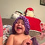 Bella joined the competition — help win amazing prizes! toddler, child, smiling, laughing, mirror, purple_bonnet, blanket, stuffed_toy, couch, indoor, happy, person, face, hand, pink, plush, home, cozy, playful, cute