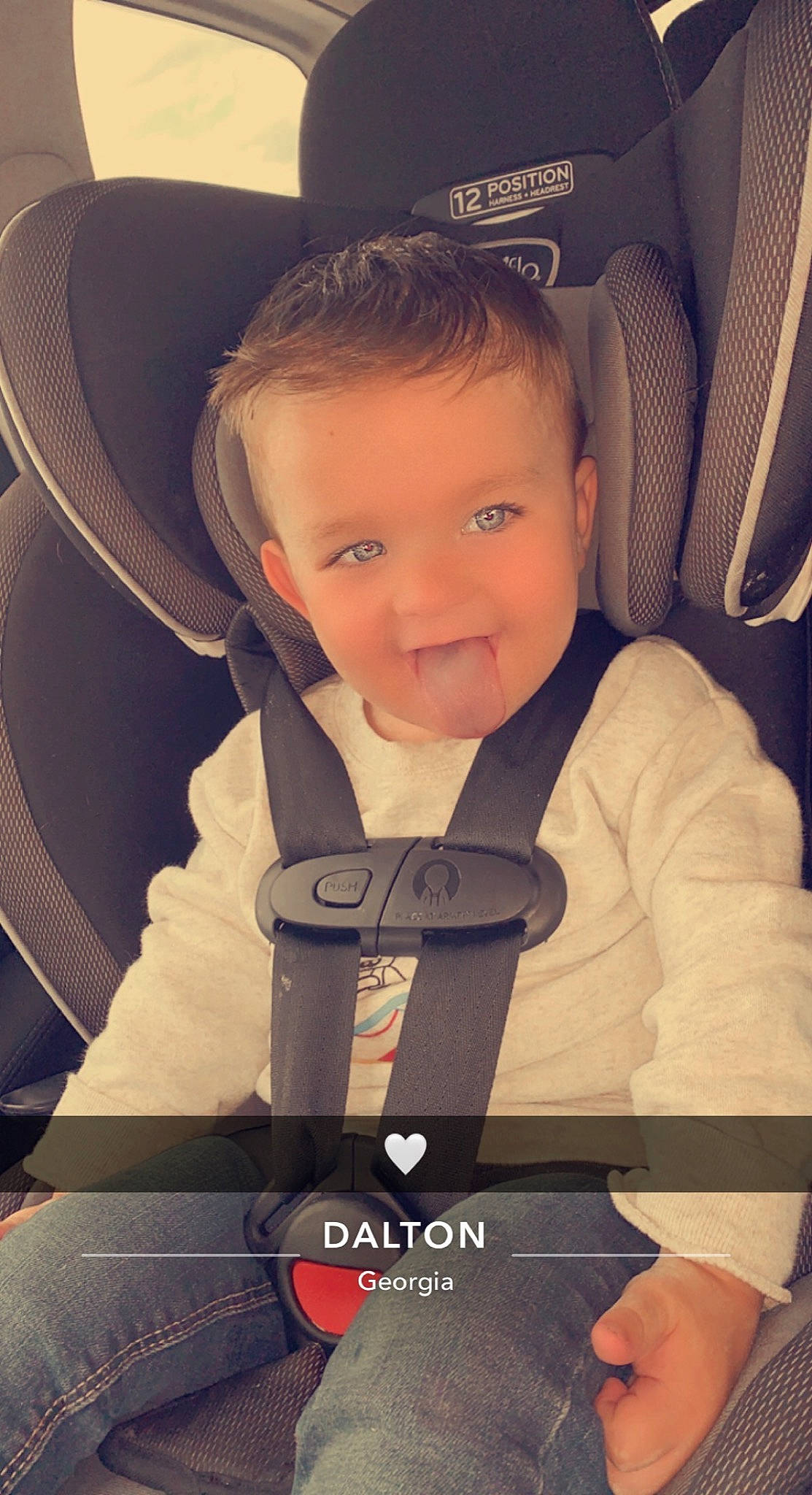 Landon is registered to the contest to win money with this photo: arm, auto_part, automotive_design, baby, baby_carriage, baby_in_car_seat, baby_products, car_seat, car_seat_cover, child, comfort, head_restraint, motor_vehicle, person, product, seat_belt, sitting, steering_part, steering_wheel, toddler