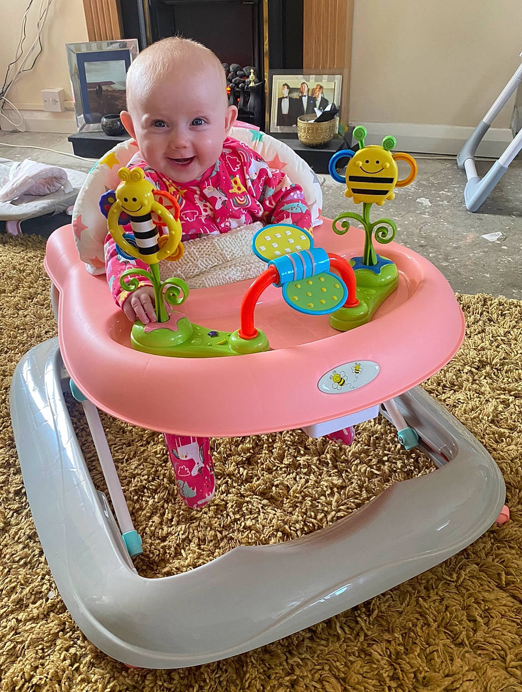 Ahya is registered to the contest to win money with this photo: baby, baby_playing_with_toys, baby_products, baby_toddler_clothing, baby_toys, chair, child, event, face, fun, happy, joy, magenta, person, pink, plastic, play, riding_toy, sharing, sitting
