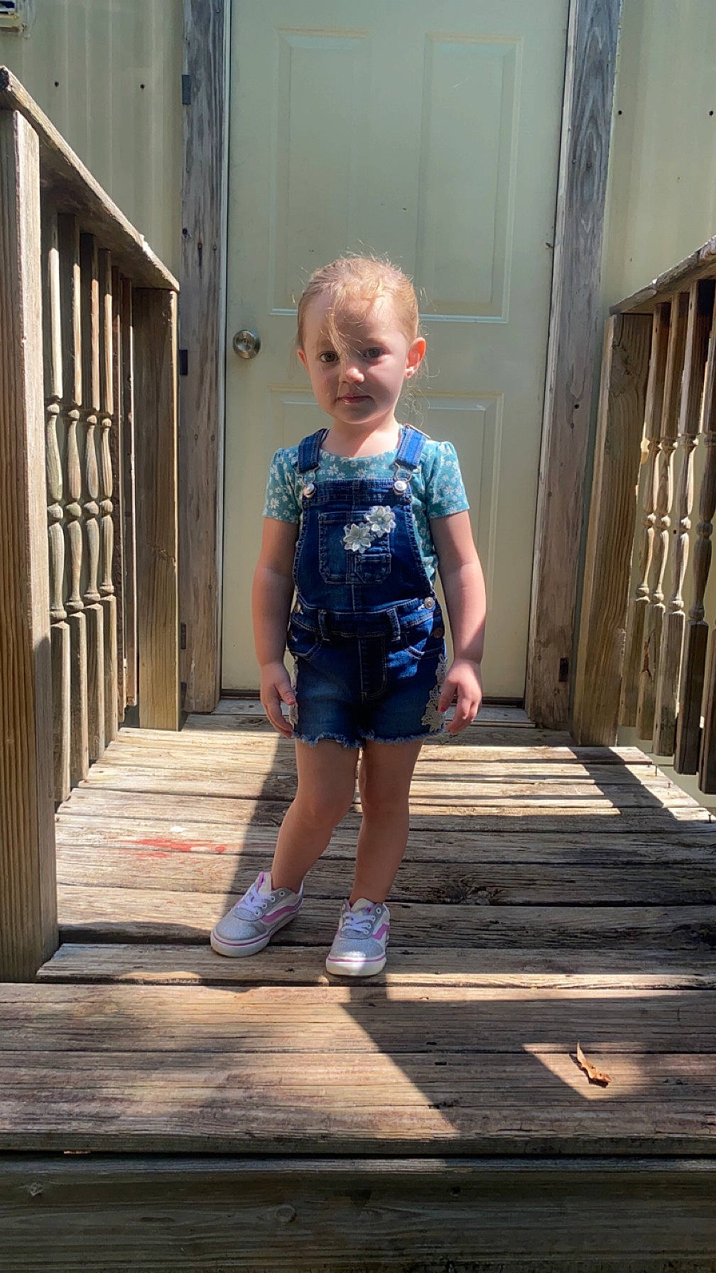 Alaina joined the competition — help win amazing prizes! blue, child, clothing, deck, denim, electric_blue, flooring, fun, hardwood, human_leg, leisure, pattern, person, shorts, t_shirt, thigh, toddler, trunk, waist, water