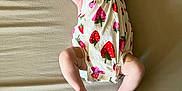 Camila is registered to the contest to win money with this photo: baby, bodypart, bonnet, cap, clothing, couch, dress, face, finger, flower, furniture, hand, hat, head, newborn, person, photography, plant, portrait, sitting