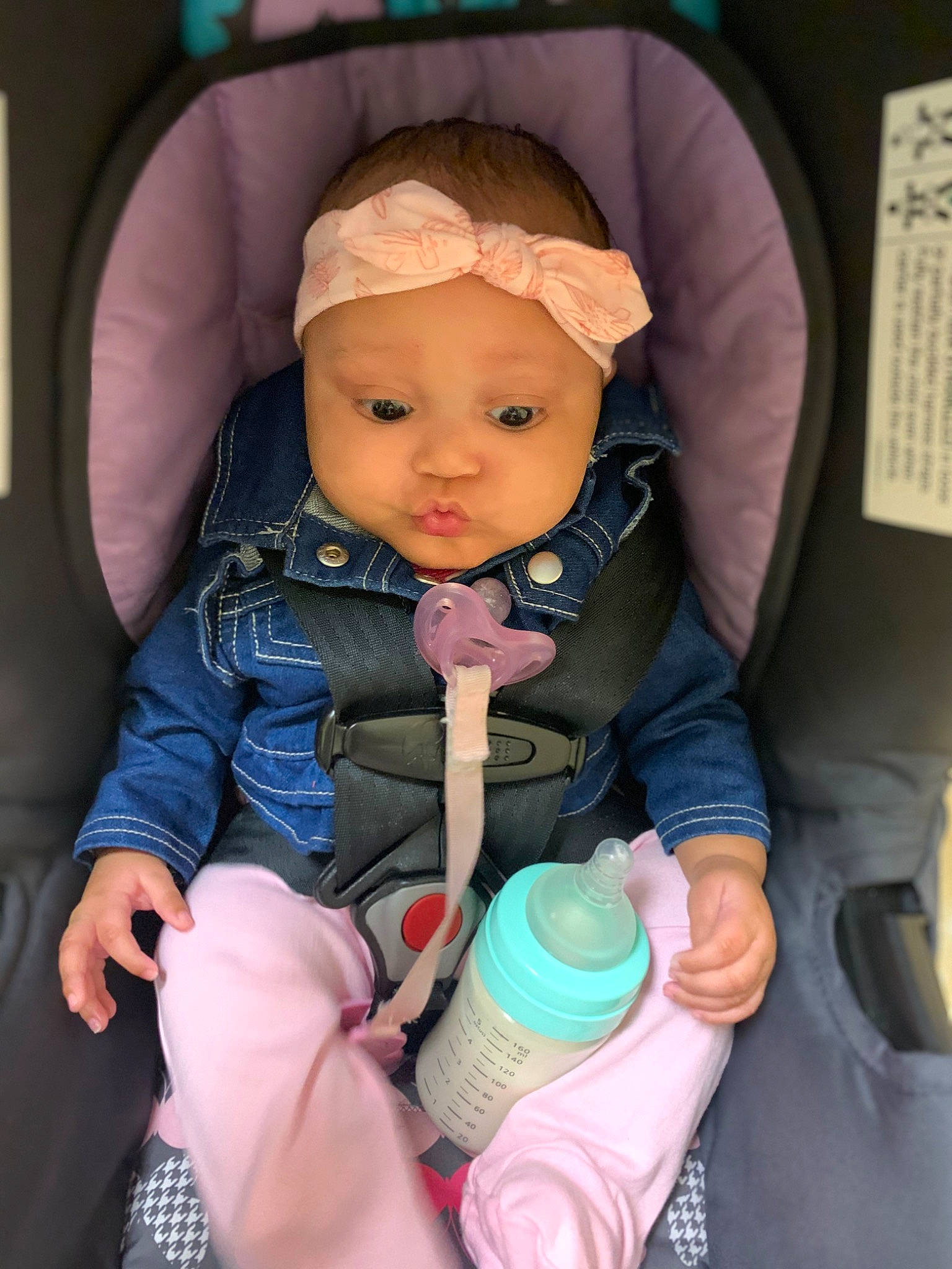 Christiauna is registered to the contest to win money with this photo: baby, baby_carriage, baby_in_car_seat, baby_products, baby_safety, baby_toddler_clothing, car_seat, cheek, child, comfort, electric_blue, face, finger, headwear, mouth, nail, person, product, seat_belt, sitting