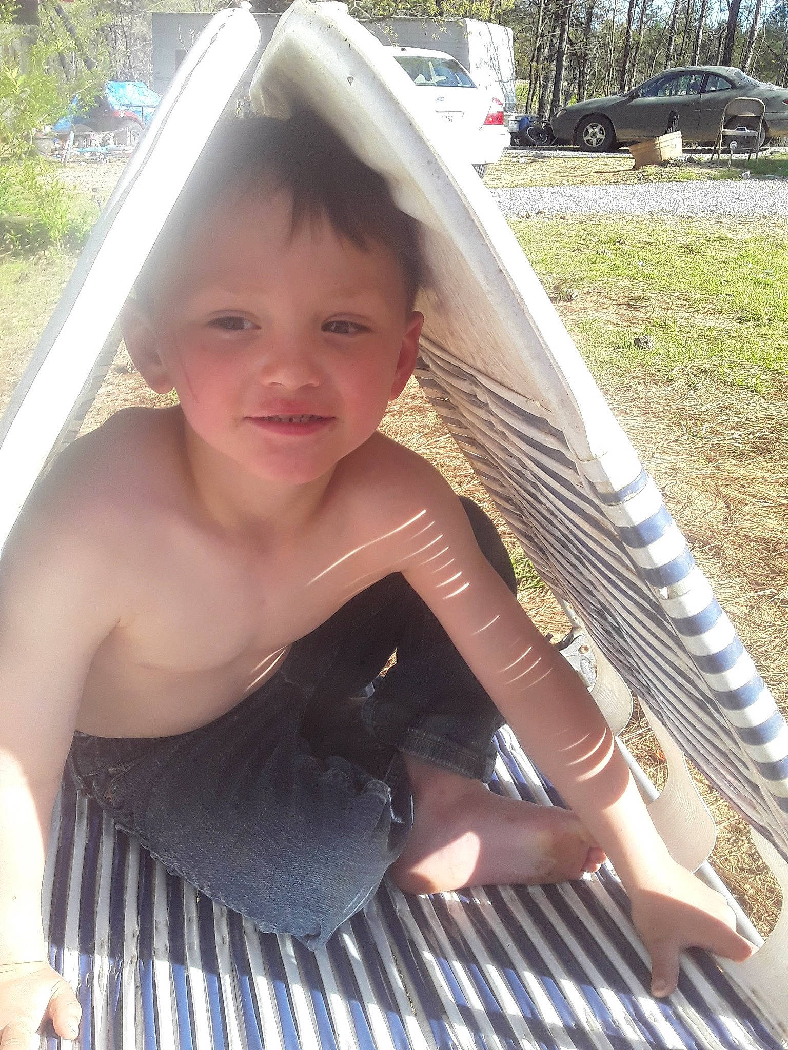 Layne joined the competition — help win amazing prizes! barefoot, chest, child, elbow, facial_expression, fun, grass, happy, head, human_leg, joy, leisure, person, plant, shade, skin, smile, sunlight, thigh, toddler