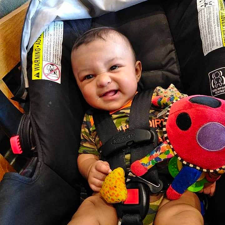 Trevor is registered to the contest to win money with this photo: auto_part, baby, baby_products, baby_toddler_clothing, car_seat, child, comfort, cool, eye, fun, hairstyle, happy, head, joy, nail, person, skin, smile, t_shirt, thumb