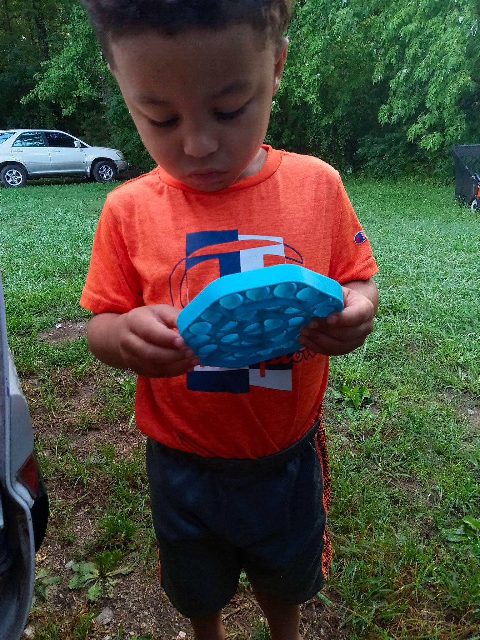 Trevor joined the competition — help win amazing prizes! car, child, electric_blue, family_car, fun, garden, grass, green, lawn, leisure, person, plant, play, recreation, shorts, soil, t_shirt, tire, toddler, tree