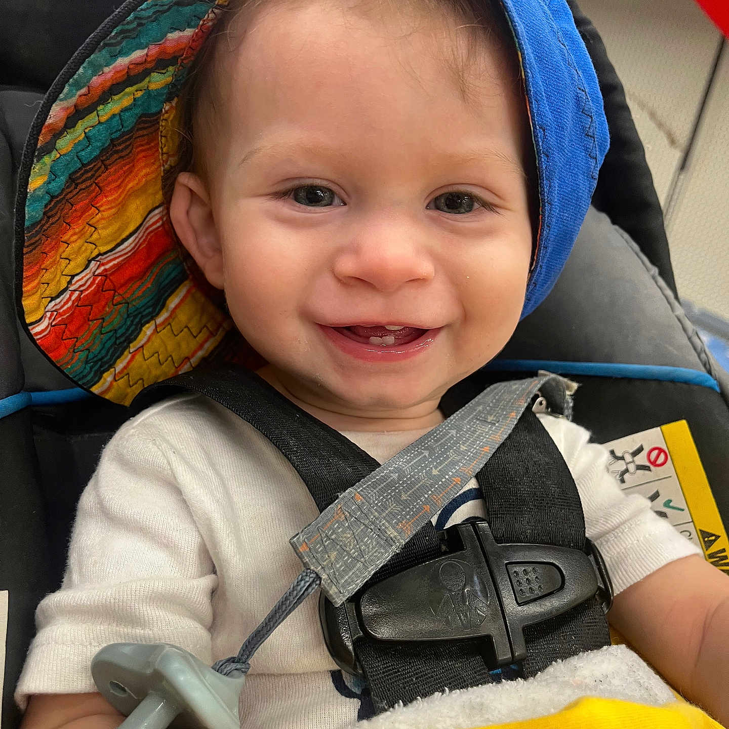 Elijah is registered to the contest to win money with this photo: accessories, baby, bodypart, clothing, coat, e_scooter, face, finger, hand, happy, hat, head, person, photography, portrait, smile, smokepipe, strap, transportation, vehicle