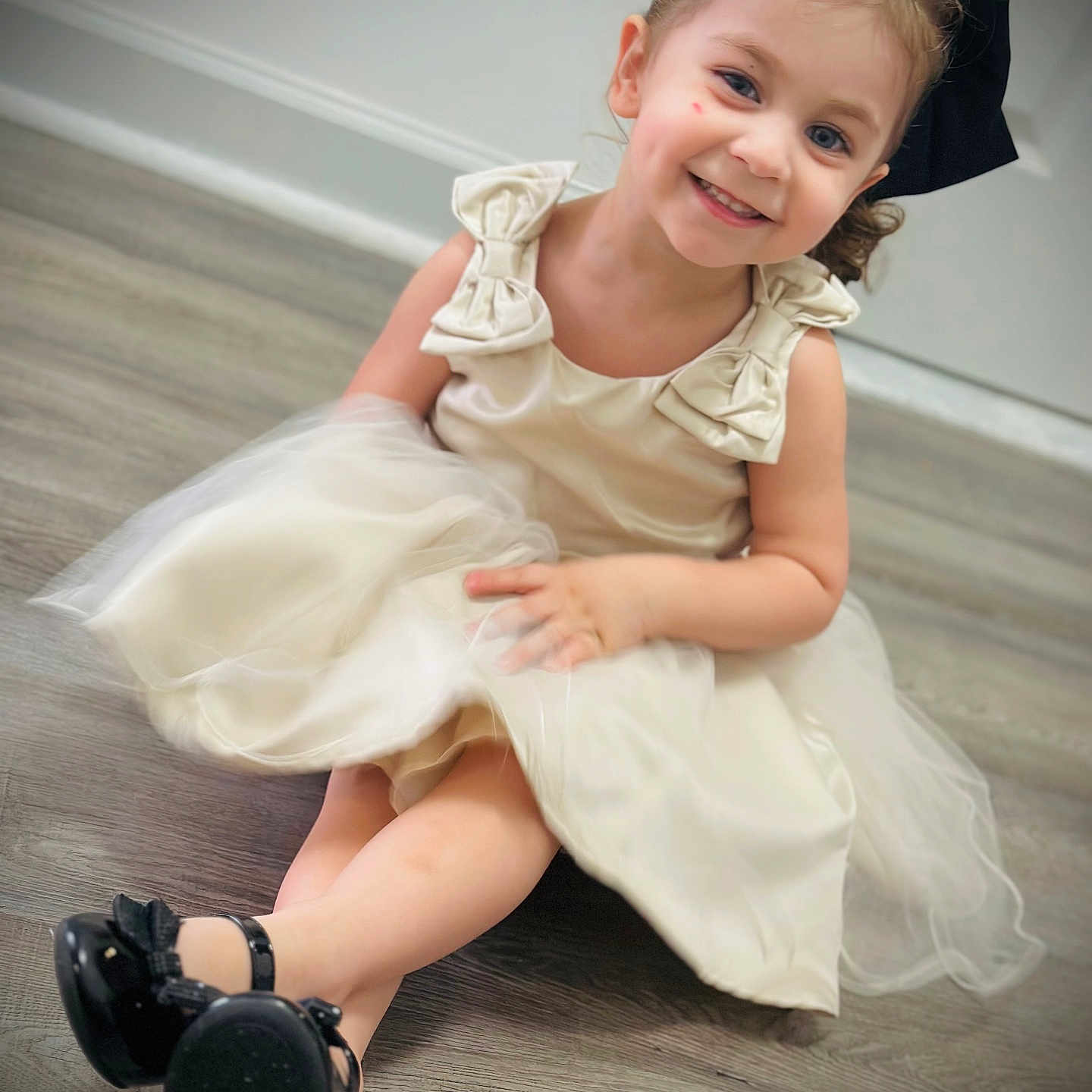 Valeria joined the competition — help win amazing prizes! black_shoes, bow, child, cute, dress, fashion, feet, floor, girl, hair, happy, indoors, person, playful, portrait, sitting, skin, smiling, toddler, young_child