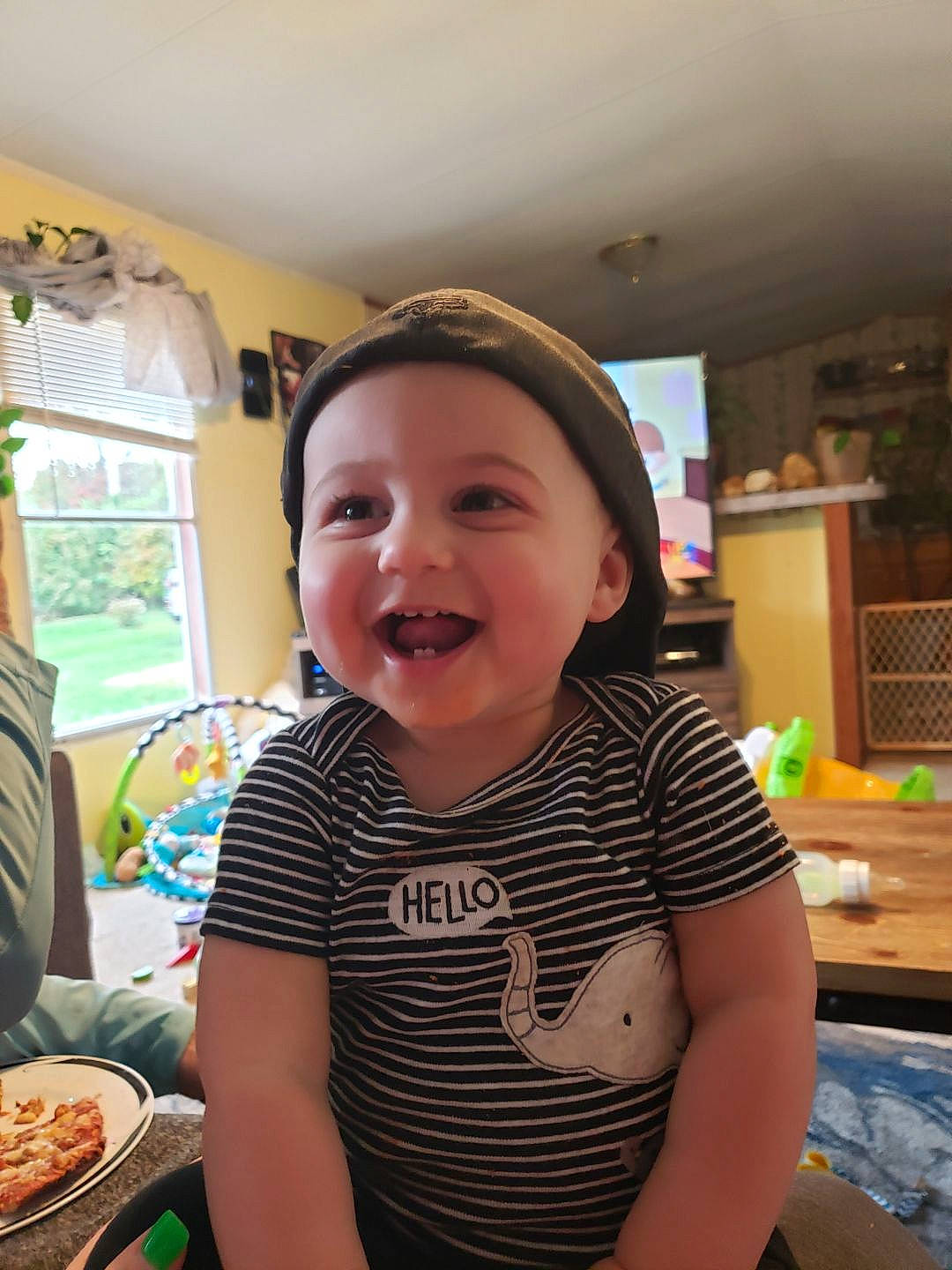 Larry is registered to the contest to win money with this photo: child, face, facial_expression, head, joy, person, smile, toddler, vacation