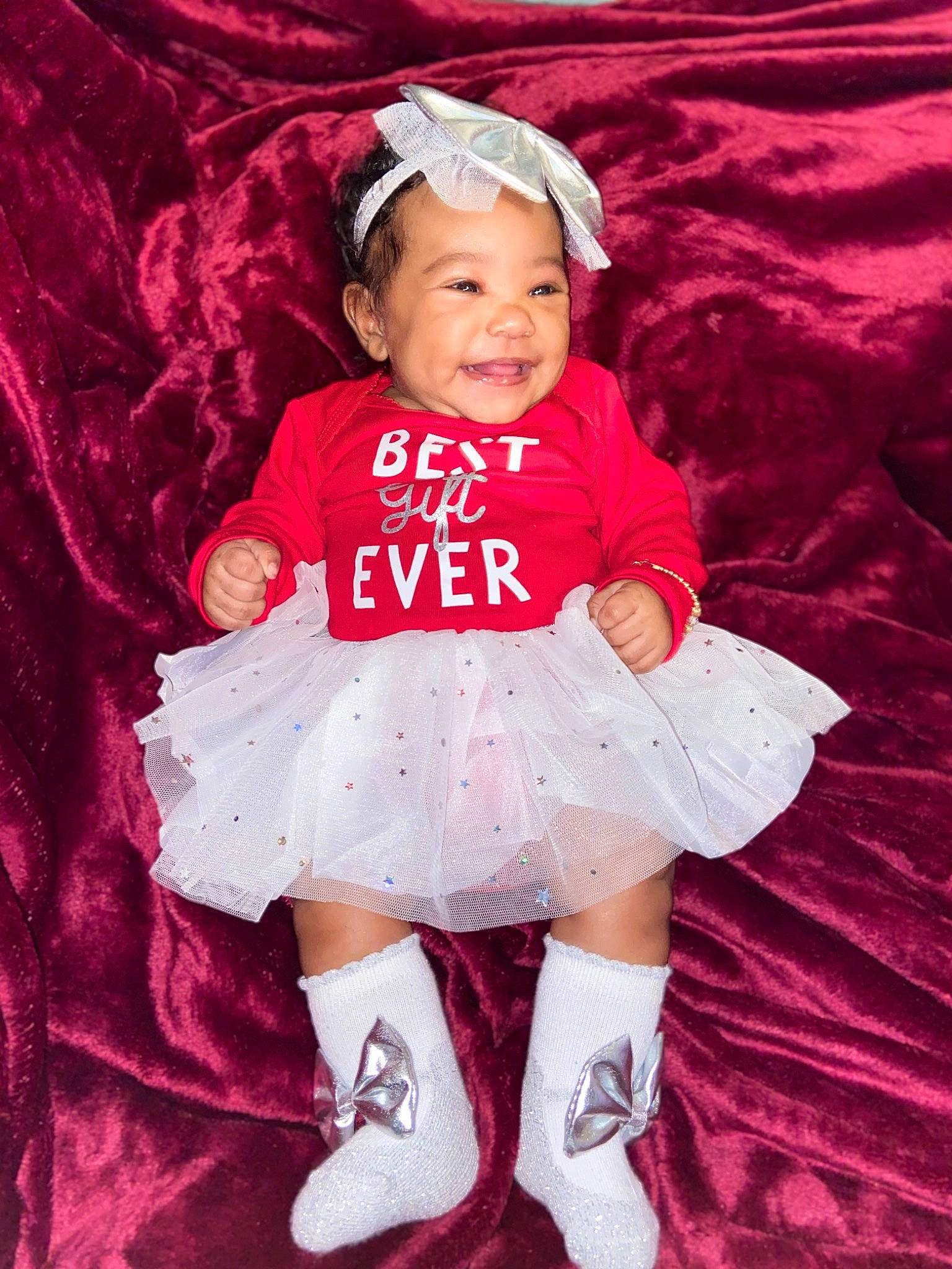 Daliylah joined the competition — help win amazing prizes! baby, baby_toddler_clothing, bonnet, cap, child, child_model, costume, costume_accessory, day_dress, embellishment, headgear, headwear, joy, mouth, person, pink, sleeve, sock, textile, toddler