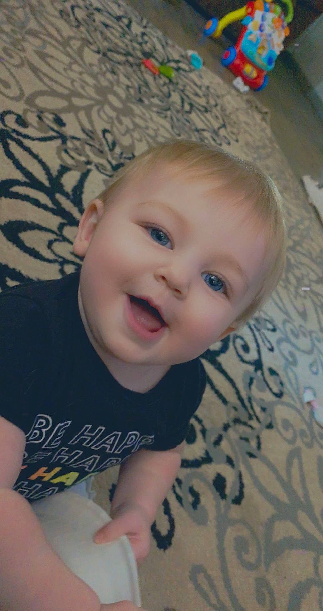 Marlowe is registered to the contest to win money with this photo: baby, baby_laughing, baby_toddler_clothing, cheek, chin, cool, eye, eyebrow, finger, floor, fun, happy, iris, lip, mouth, nose, person, skin, sleeve, smile