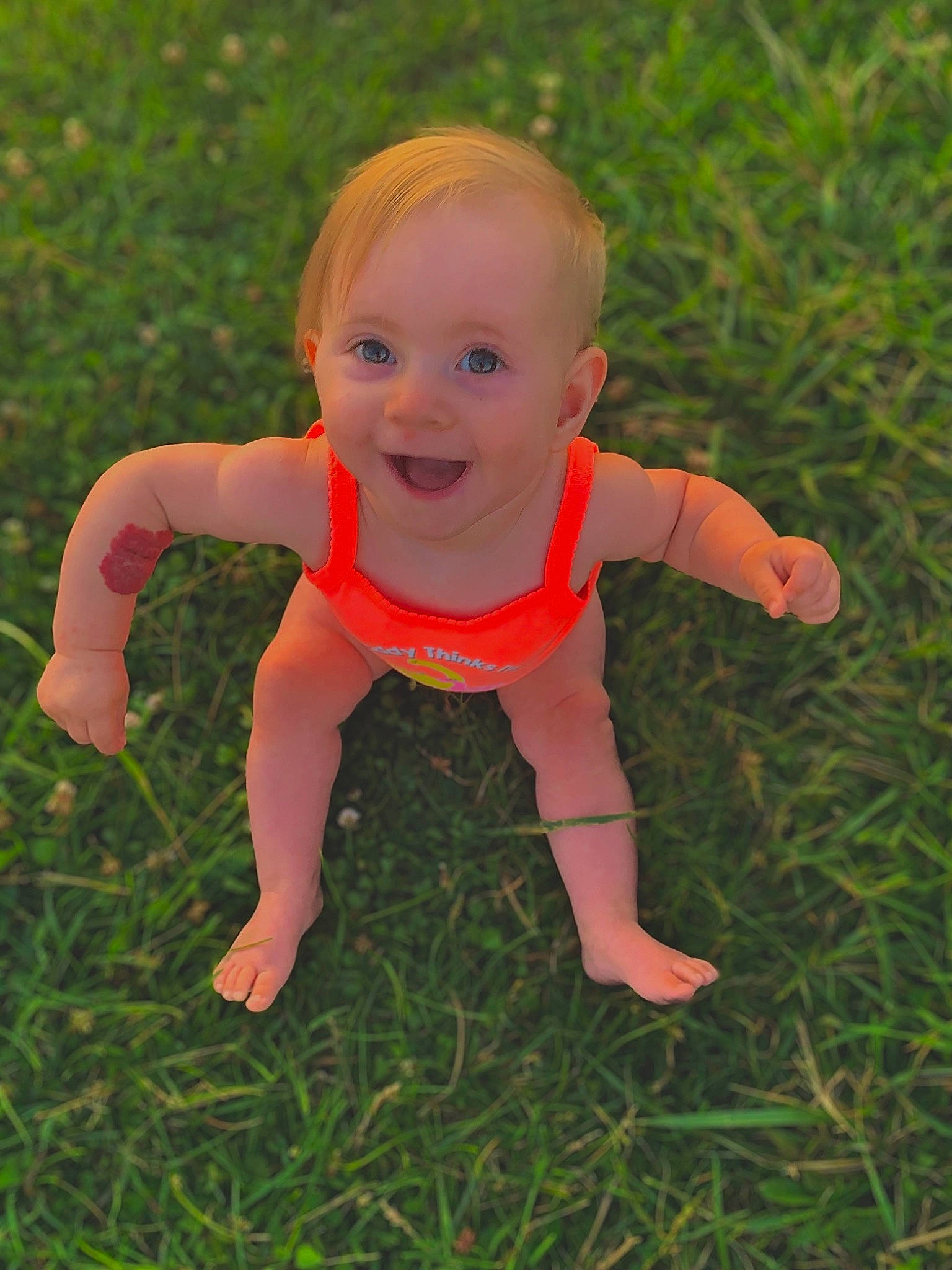 Adaline joined the competition — help win amazing prizes! baby, baby_toddler_clothing, cheek, eye, finger, grass, grassland, happy, head, human_body, mammal, meadow, nose, people_in_nature, person, plant, skin, smile, toddler, vertebrate