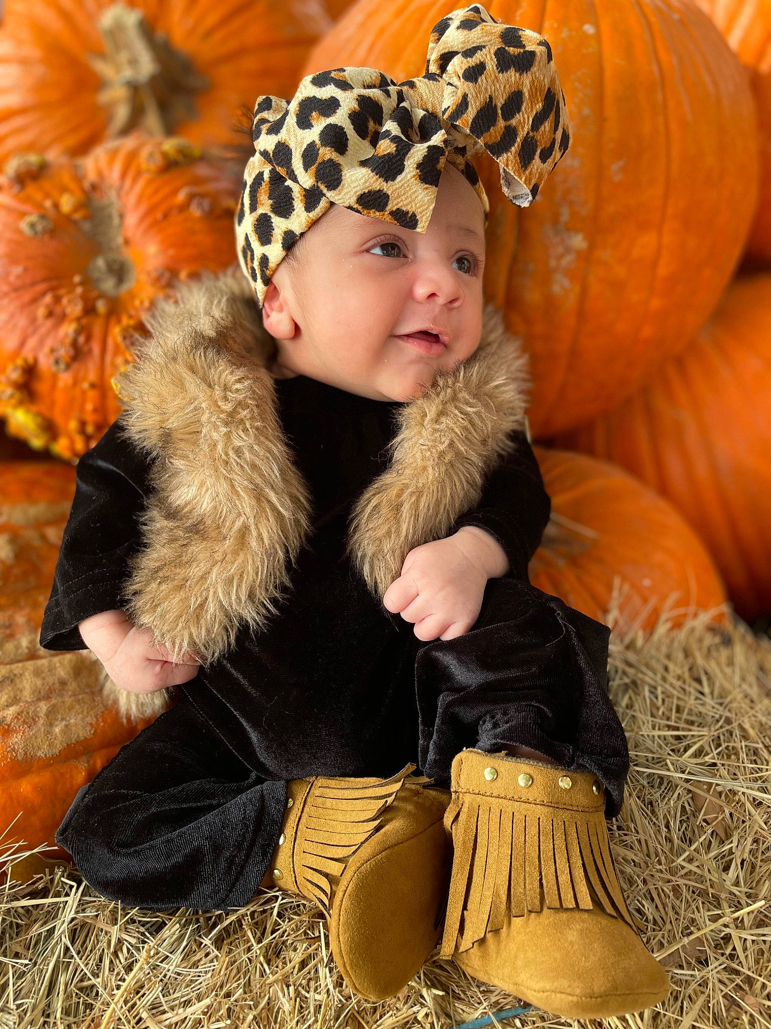 Hevnlyn Soul is registered to the contest to win money with this photo: baby, baby_toddler_clothing, calabaza, child, fun, fur, gourd, grass, happy, headwear, natural_foods, natural_material, people_in_nature, person, photograph, plant, pumpkin, sitting, smile, squash