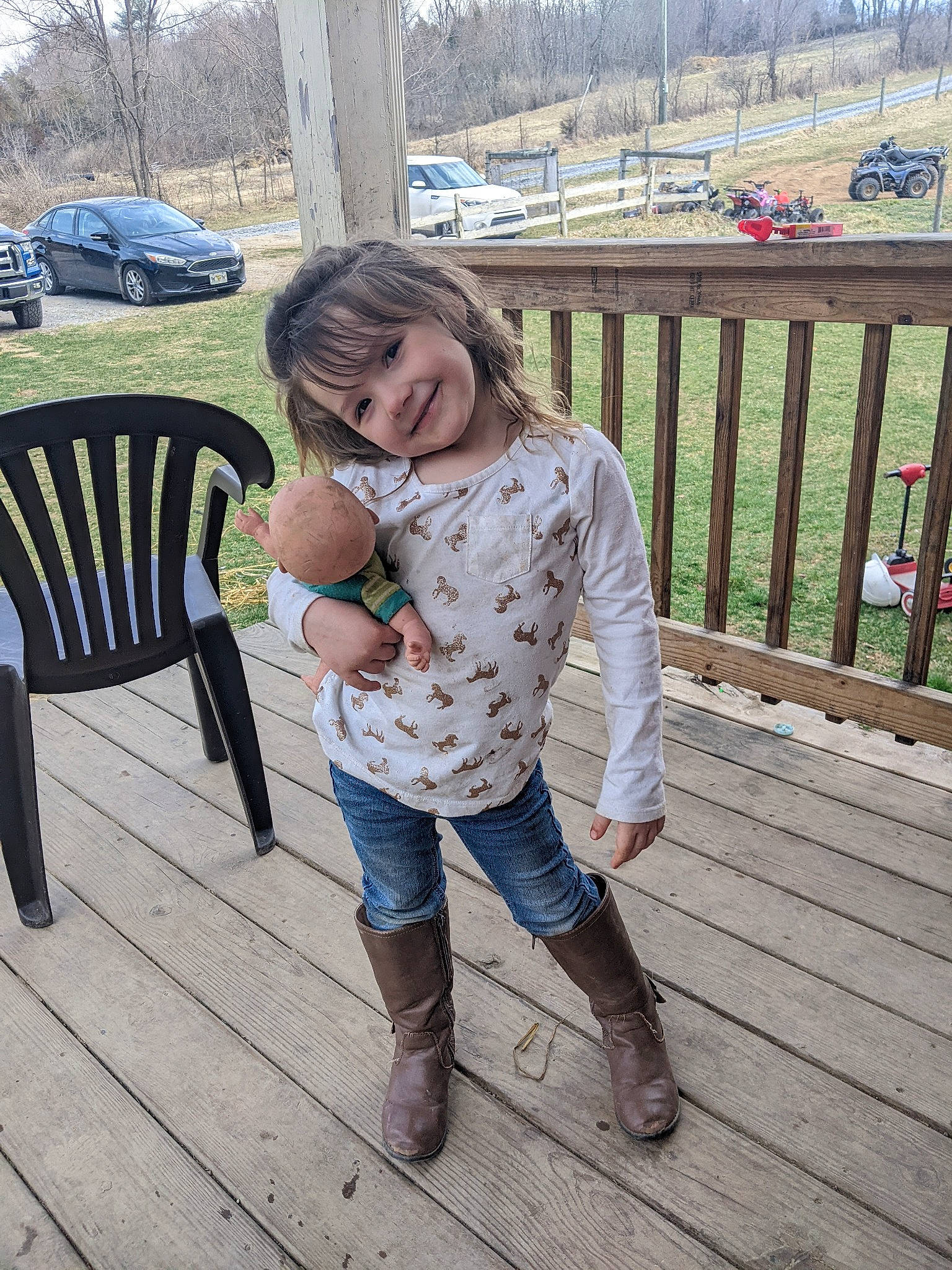 Adrian is registered to the contest to win money with this photo: car, event, fence, grass, happy, human_leg, joy, leisure, long_hair, pattern, person, plant, recreation, sandal, shoe, sneakers, thigh, tire, tree, waist