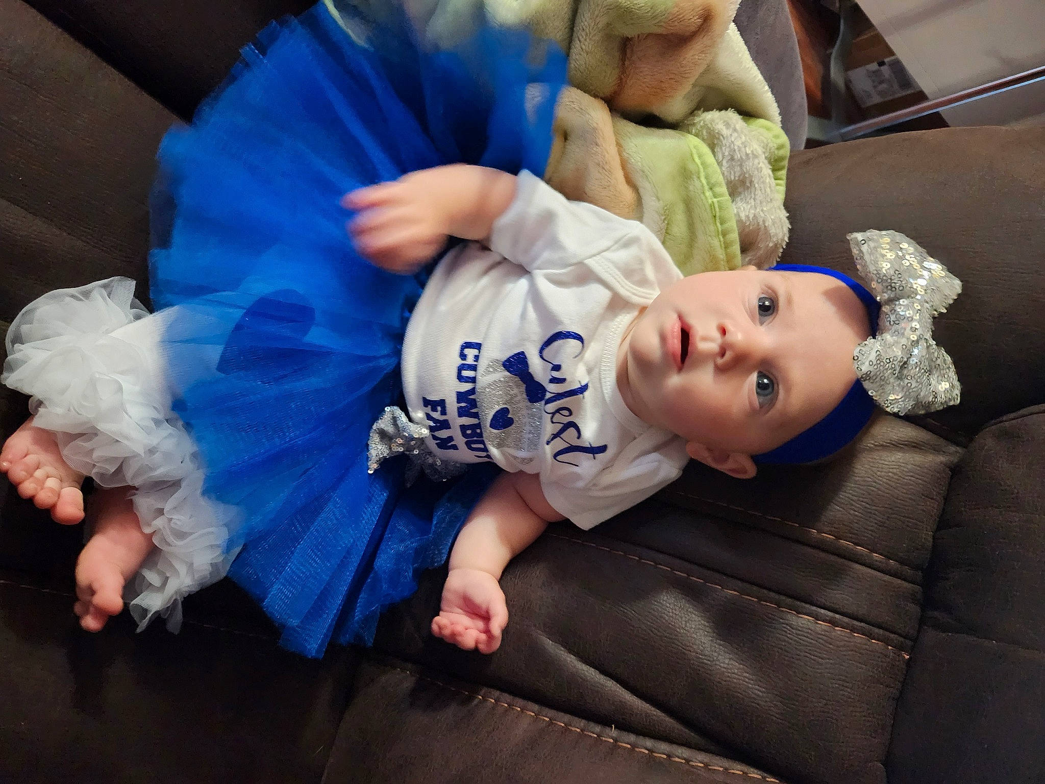 Lily is registered to the contest to win money with this photo: abdomen, baby, baby_products, baby_toddler_clothing, child, comfort, couch, electric_blue, flash_photography, fun, fur, happy, human_body, human_leg, luxury_vehicle, nap, person, room, sitting, sleep