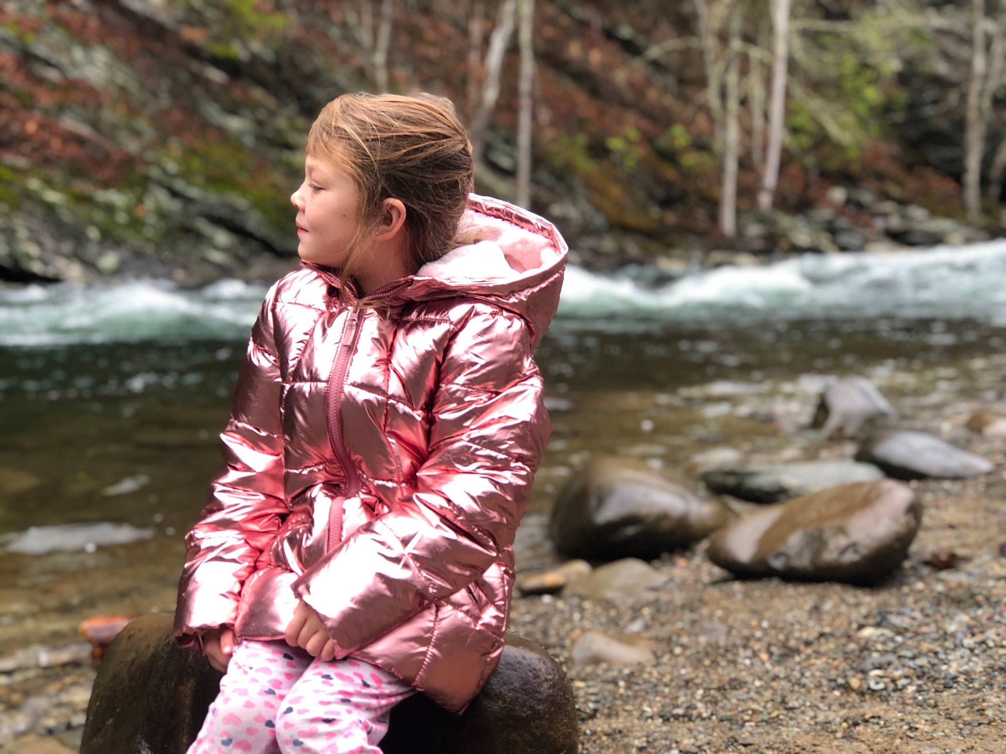 Nichole is registered to the contest to win money with this photo: bank, outerwear, person, recreation, rock, spring, stream, water