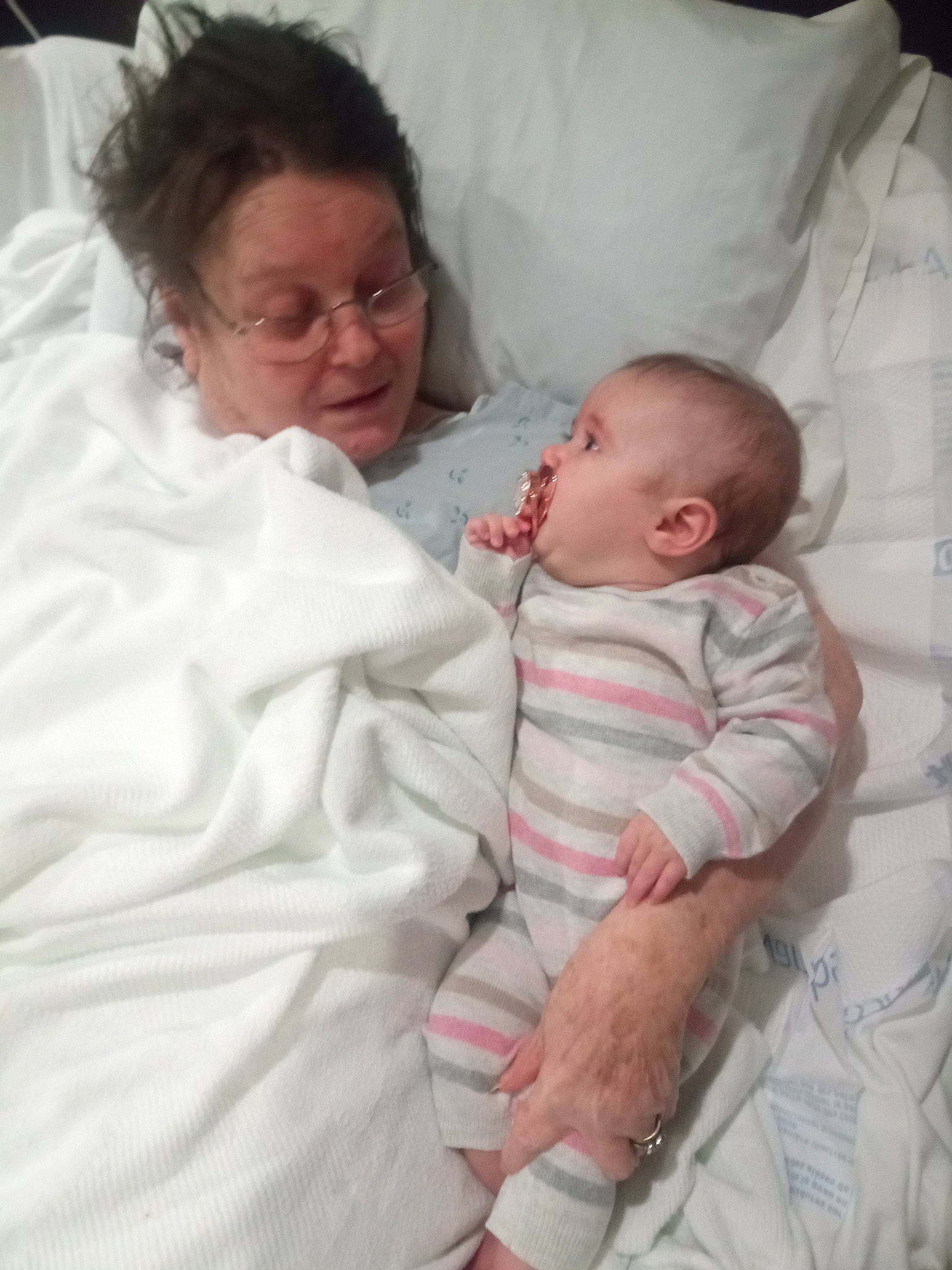 Desiyelle is registered to the contest to win money with this photo: baby, bed, bedding, bedtime, child, comfort, event, eyewear, face, glasses, head, hospital, hospital_bed, linens, nap, person, room, skin, sleep, toddler