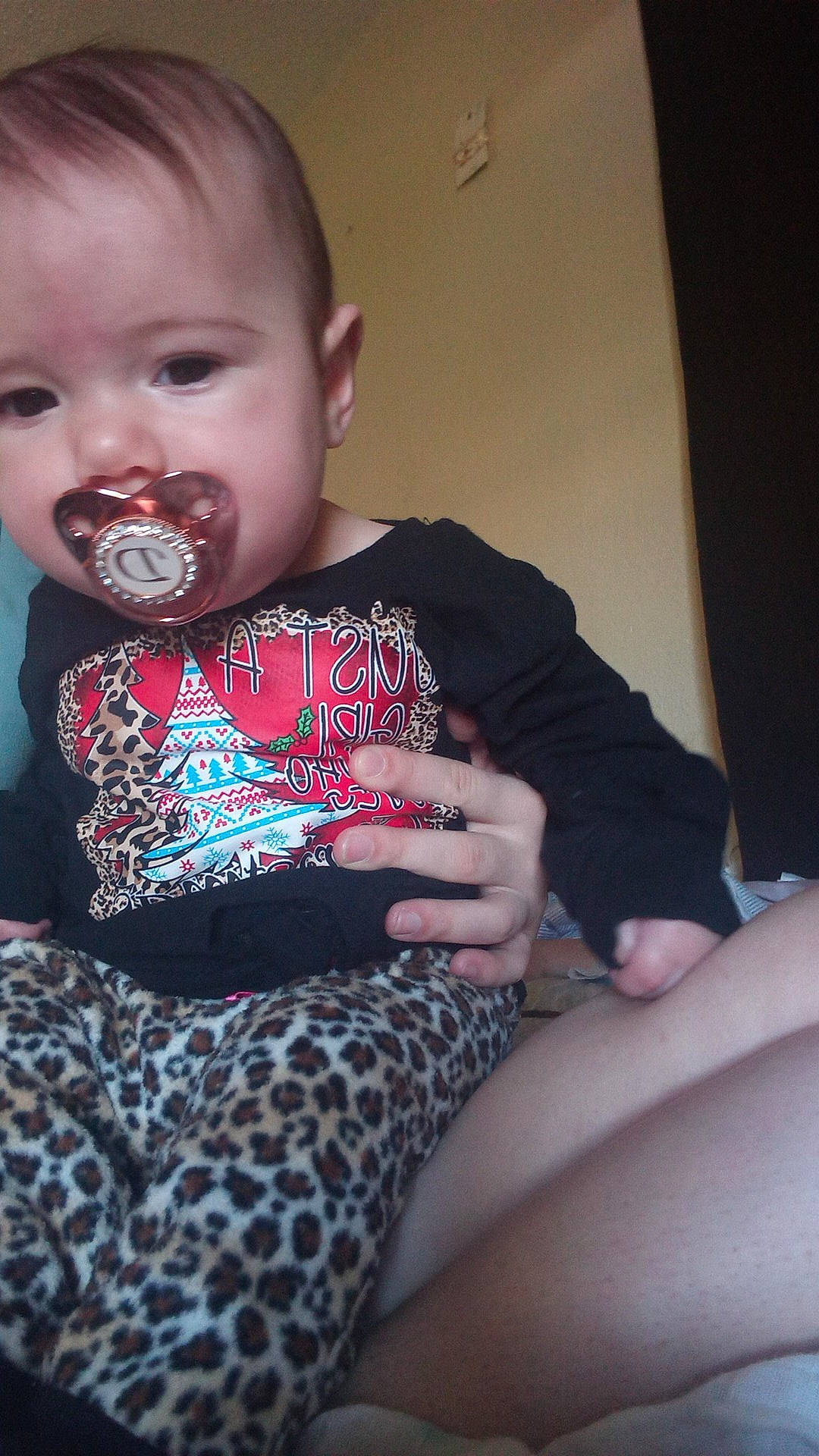Desiyelle is registered to the contest to win money with this photo: arm, baby, baby_toddler_clothing, cheek, comfort, finger, happy, human_leg, iris, knee, lap, lip, mouth, nail, neck, pattern, person, sitting, sleeve, thigh