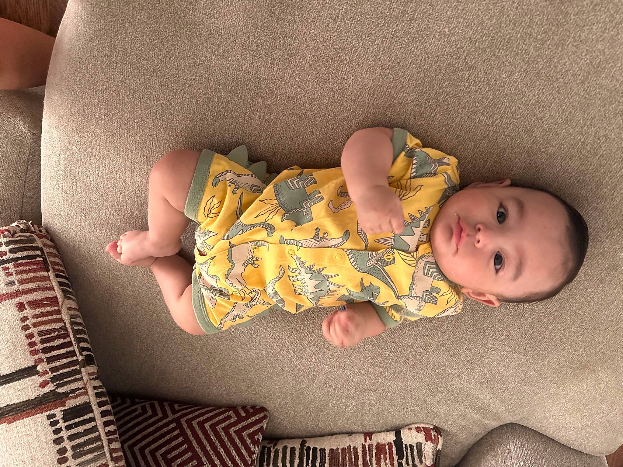 Kyle is registered to the contest to win money with this photo: baby, baby_sleeping, baby_toddler_clothing, cheek, child, comfort, couch, finger, flooring, hand, human, human_body, human_leg, leg, linens, pattern, person, skin, thigh, toddler