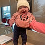 baby, cap, clothing, coat, computerhardware, electronics, face, footwear, happy, hardware, hat, head, jacket, monitor, pants, person, photography, portrait, screen, shoe