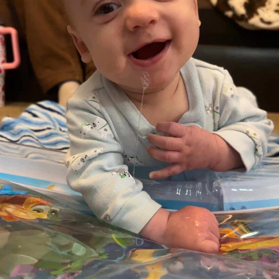 Raven joined the competition — help win amazing prizes! animal, baby, bodypart, couch, face, finger, fish, furniture, hand, happy, head, mouth, person, photography, portrait, sealife, sitting, smile, spitting, water