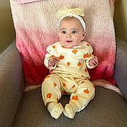 Charlotte joined the competition — help win amazing prizes! baby, child, infant, sitting, chair, blanket, headband, clothing, pumpkin_pattern, cozy, cute, indoors, portrait, soft_lighting, smile, cute_outfit, footwear, pink, white, gray